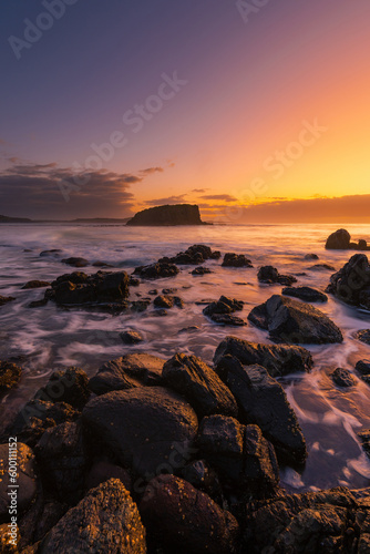 Rock formation and Stack Island view with sunrise glow at Minnamurra, NSW, Australia.