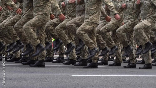 Military men marching in the parade. Soldiers legs. Boots forces and infantry soldier. Army march. Defender team. Crowd man go. Armed forces walking in a row. Pixel uniform. War background.
