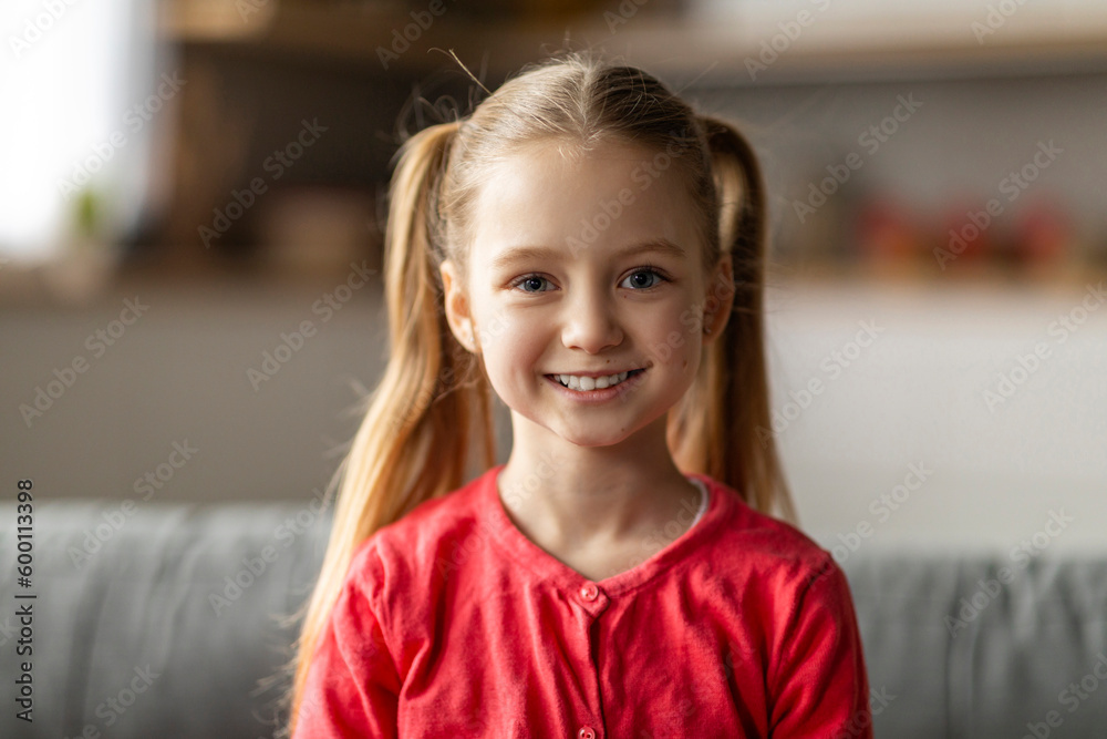 Cute Child. Closeup Portrait Of Happy Little Girl Posing In Home Interior Cute Child. Closeup Portrait Of Happy Little Girl Posing In Home Interior