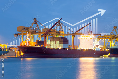 Cargo ship, cargo container work with crane at dock, port or harbour. Freight transport with up arrow, increase graph or bar chart. Concept for export, growth market, trade, profit, demand and supply. photo