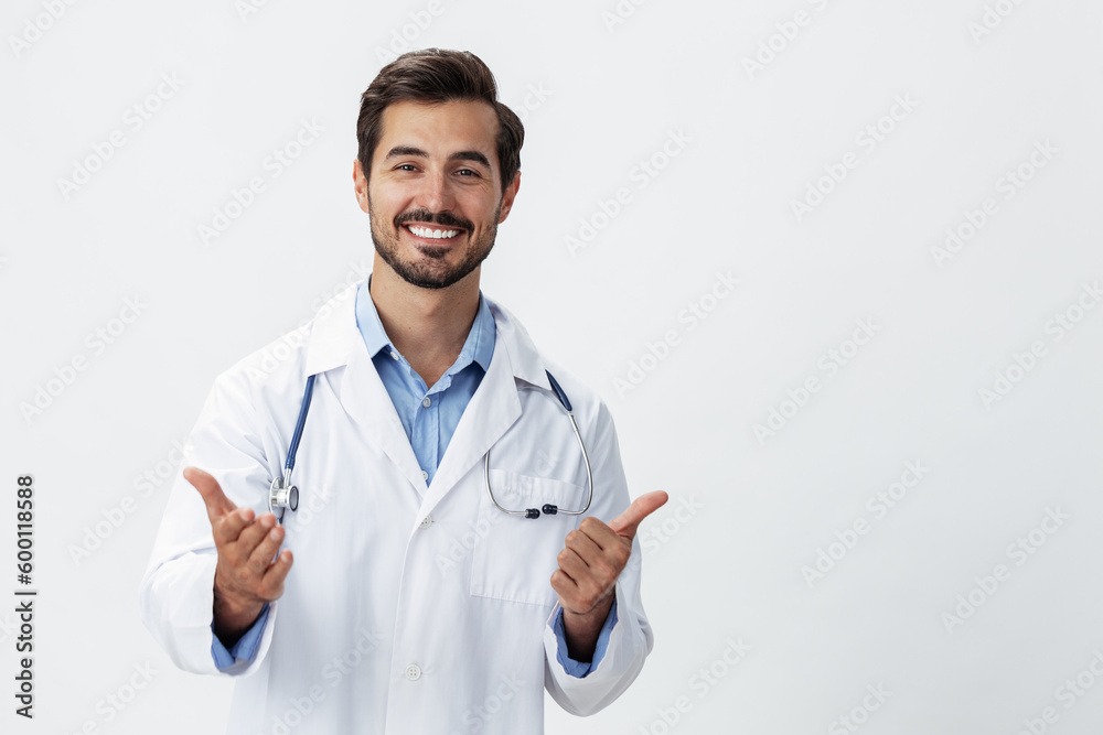 man doctor in a white coat with a stethoscope and wearing glasses for a smile hands up victory and happiness on a white isolated background looking into the camera, copy space, space for text, health