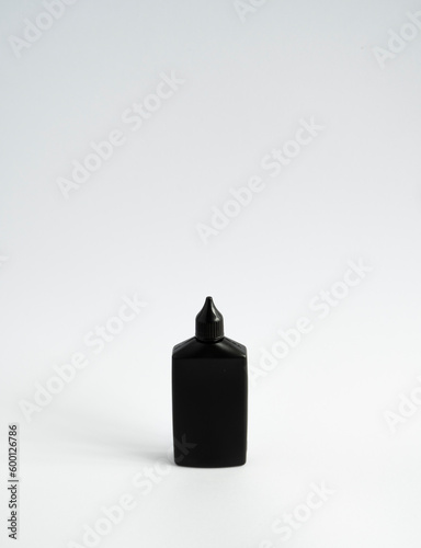 Mock up unbranded black bottle of finish line dry bicycle lubricant. Bicycle care, bicycle chain care.