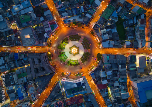 Wongwian Yai roundabout. Aerial view of highway junctions. Roads shape circle in structure of architecture and technology transportation concept. Top view. Urban city, Bangkok, Thailand. © tampatra