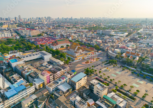 Aerial view of Bangkok Downtown Skyline with temples, Thailand. Financial district and business centers in smart urban city in Asia. Skyscraper and high-rise buildings at sunset.