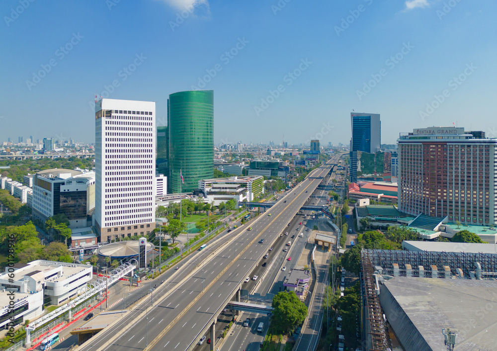 Fototapeta premium Aerial view of Bangkok Downtown Skyline, Thailand. Financial district and business centers in smart urban city in Asia. Skyscraper and high-rise buildings at sunset.