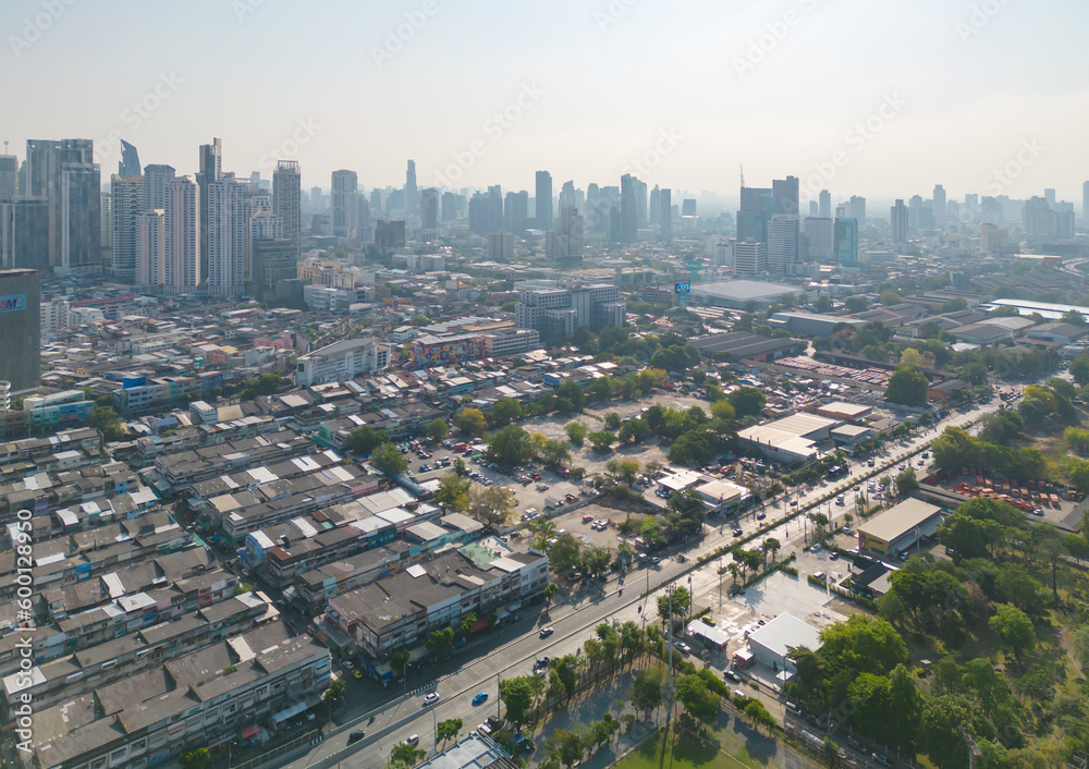 Fototapeta premium Aerial view of Bangkok Downtown Skyline, Thailand. Financial district and business centers in smart urban city in Asia. Skyscraper and high-rise buildings at sunset.