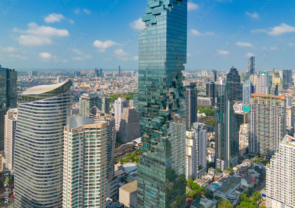 Naklejka premium Aerial view of Bangkok Downtown Skyline, Thailand. Financial district and business centers in smart urban city in Asia. Skyscraper and high-rise buildings at sunset.