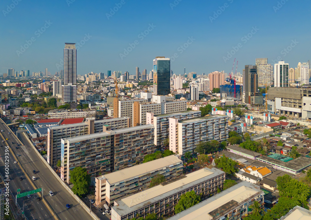 Fototapeta premium Aerial view of Bangkok Downtown Skyline, Thailand. Financial district and business centers in smart urban city in Asia. Skyscraper and high-rise buildings at sunset.
