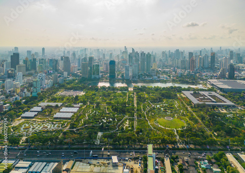 Aerial view of green trees in Lumpini Park, Sathorn district, Bangkok Downtown Skyline. Thailand. Financial district and business center in smart urban city in Asia. Skyscraper buildings