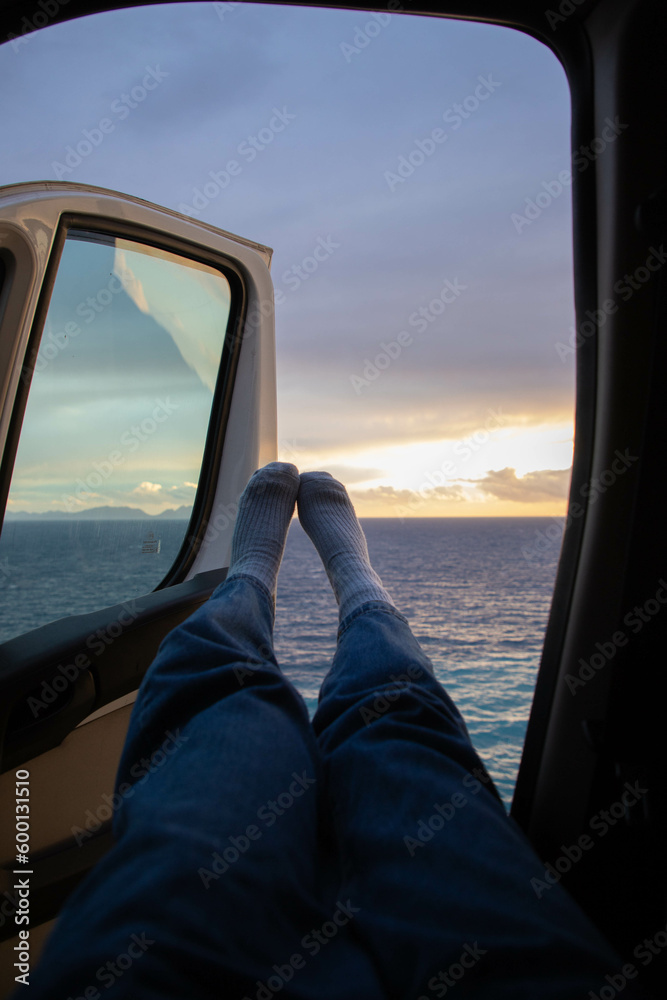 travelling in a car near the sea in sunset