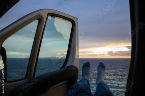 travelling in a car near the sea in sunset