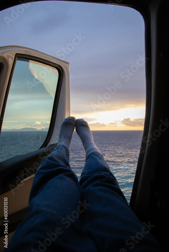 travelling in a car near the sea in sunset