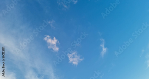 Blue summer clouds gradient background with clear clouds in sunlight in day horizon environment.