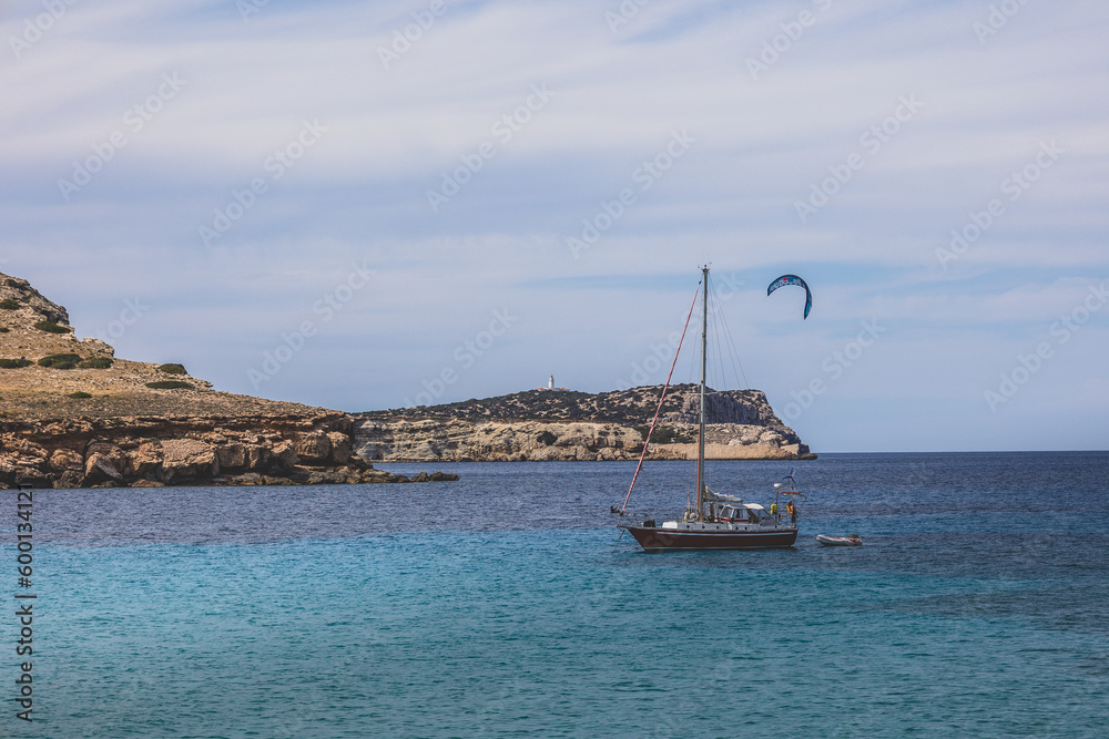 Beautiful sandy Cala Comte beach with azure blue sea water, Ibiza island, Spain