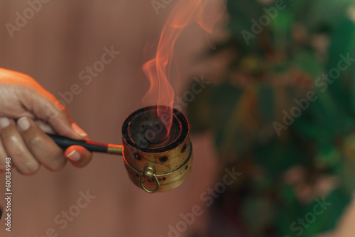 Moxibustion treatment: Traditional Chinese medicine tools for heating acupuncture point therapy. chinese herbal medicine Copper moxibustion burner box with herbal moxa sticks in holistic clinic.
