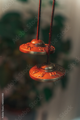 Sound massage, treatment with Tibetan bowls in the spa salon. Female meditation during traditional Nepalese practices using the vibration of bronze bowls for energy recovery