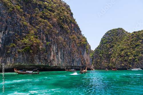 Pier or jetty on phi phi leh island in krabi in thailand near maya bay with boats and tourists on a hot sunny day. Travel and vacation.