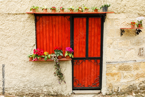 red door in a village stone house
