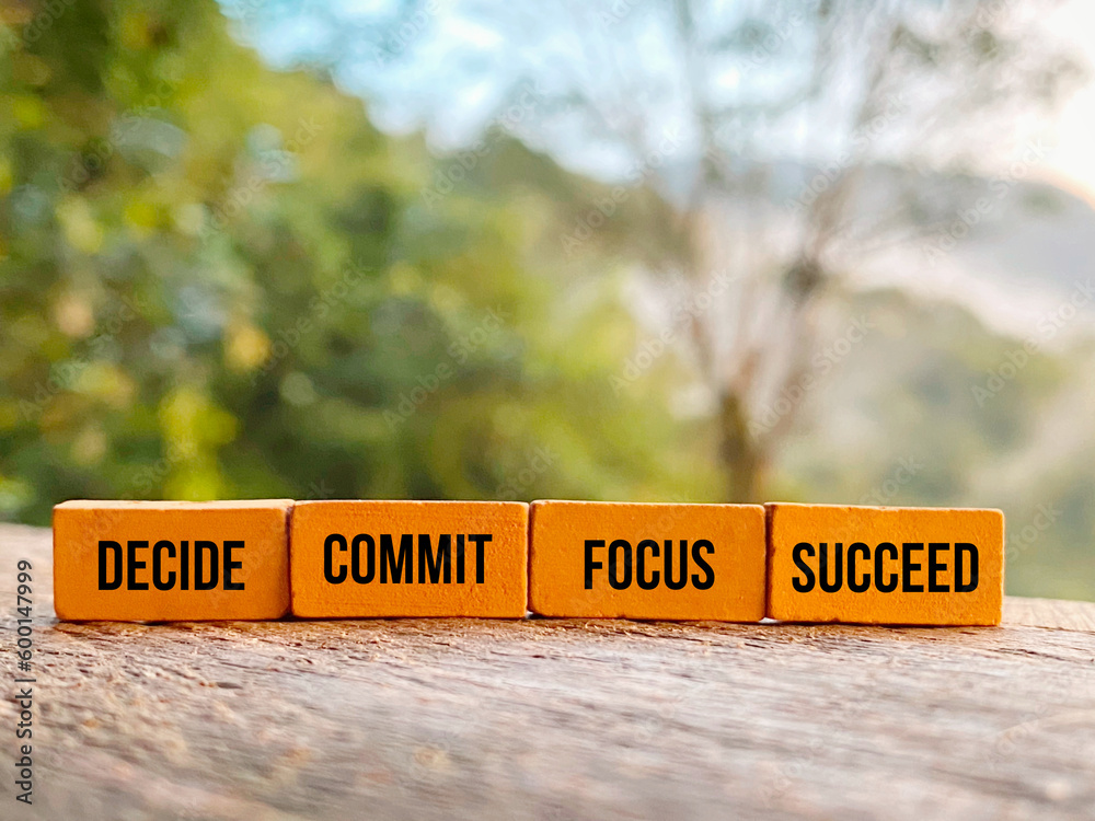Inspirational and motivational quote - decide commit focus succeed on bricks background. - obrazy, fototapety, plakaty 