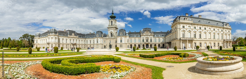 Keszthely, Beautiful Baroque Palace of the Festetics family (Helikon Palace Museum) Historical architecture in Hungary Panorama blue sky with picturesque clouds, spring gardens. Keszthely 30.04.2023