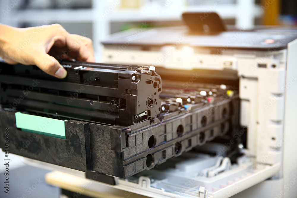 Technician hand open cover printer photocopier or photocopy to replace ink cartridges or fix paper jam for scanning fax or copy document in office workplace. Technician hand open cover printer photocopier or photocopy to replace ink cartridges or fix paper jam for scanning fax or copy document in office workplace.