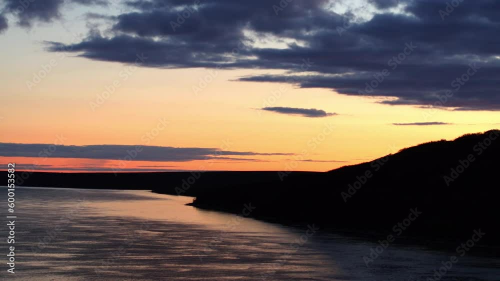 Aerial Panning Shot Of Sea Near Silhouette Hills Against Cloudy Sky At Sunset, Drone Flying Over Natural Landscape - Bering Sea, Alaska