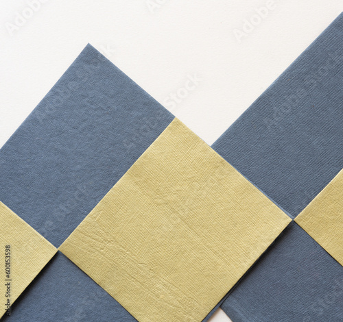 neutral yellow/green and gray paper tiles with texture on blank paper