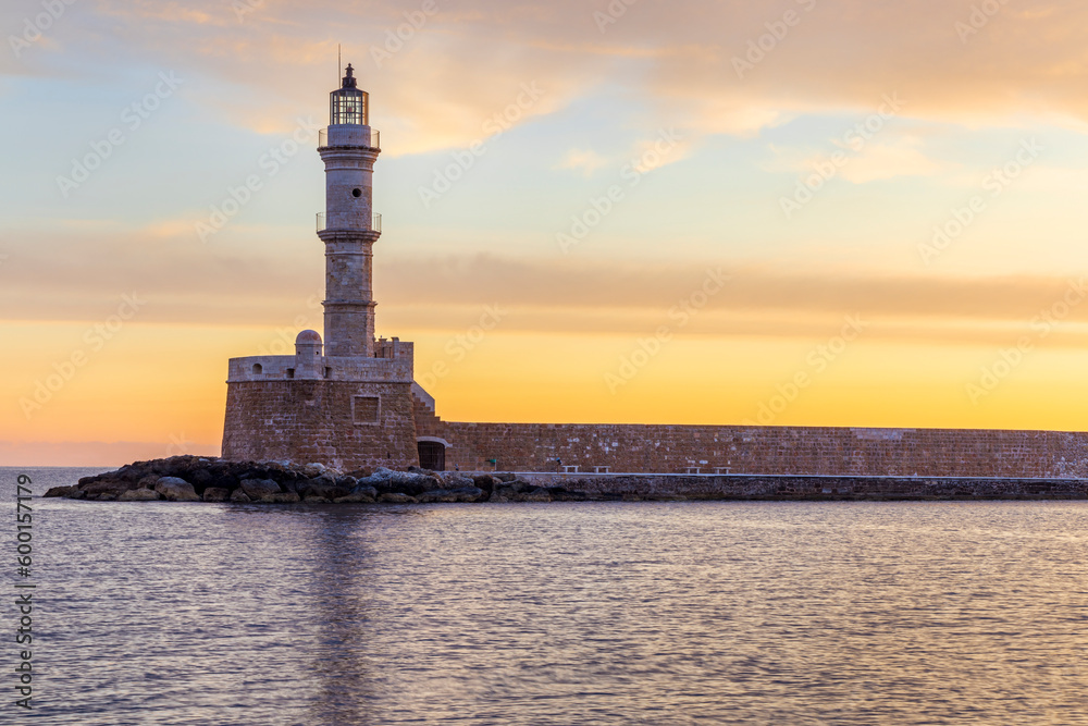 Chania lighthouse at sunrise, Old Venetian Harbour, Crete Island, Greece