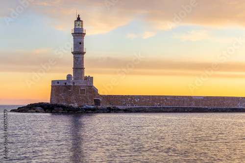 Chania lighthouse at sunrise, Old Venetian Harbour, Crete Island, Greece