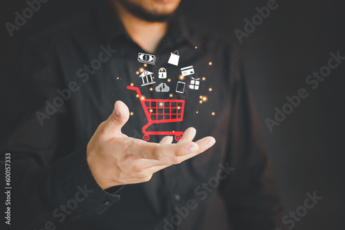 Online shopping and payment, Businessman or customer using smartphone with shopping and business icon, Online shopping and e-commerce technology internet concept.