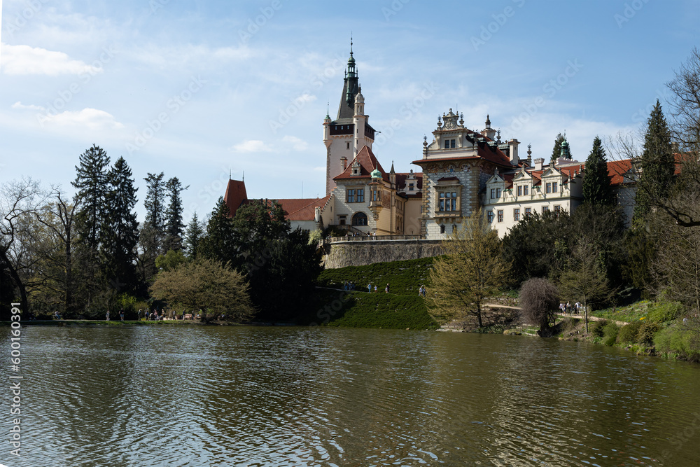 general view of the facade of the 19th-century Pruhonitsky Castle on a sunny spring day.