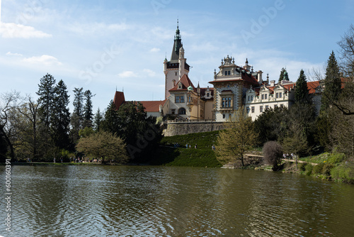 general view of the facade of the 19th-century Pruhonitsky Castle on a sunny spring day.