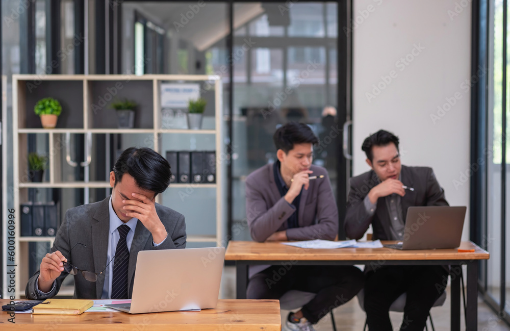 Concept Burnout Syndrome. Businessman feels uncomfortable working. Which is caused by stress, accumulated from unsuccessful work And less resting body. Consult a specialist psychiatrist.