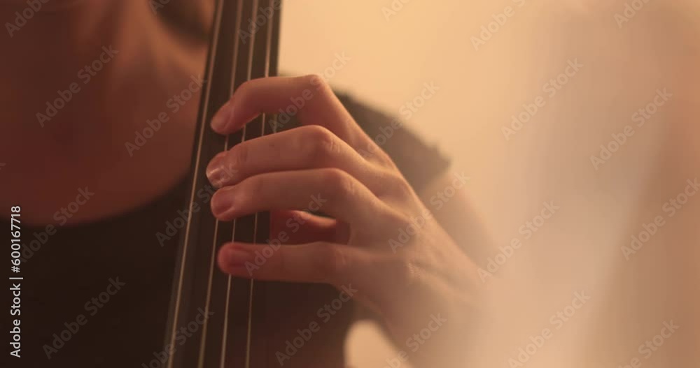 Single woman playing the cello, close-up and medium close-up, cello bow and strings, smooth transitions of the camera from focus to out-of-focus, beautiful filmic, artistic shots. Single woman playing the cello, close-up and medium close-up, cello bow and strings, smooth transitions of the camera from focus to out-of-focus, beautiful filmic, artistic shots.