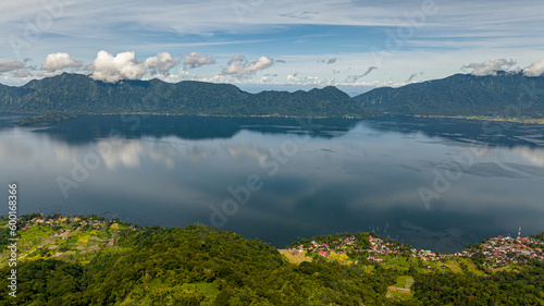 Top view of beautiful blue Maninjau lake and farmland in a volcano crater. Sumatra  Indonesia.
