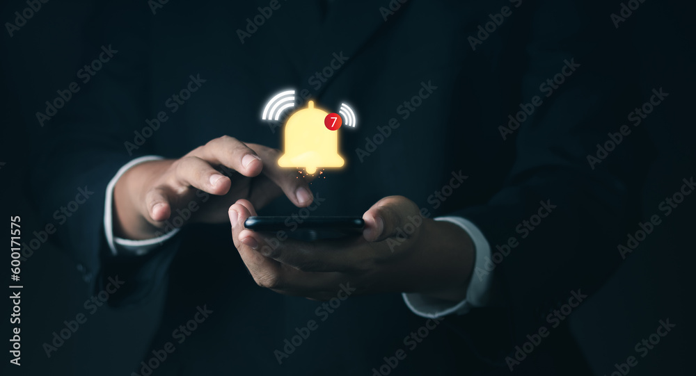 Push notification. smartphone with virtual yellow bell ringing for application notification alert concept. Businessman holding smartphone with virtual yellow bell ringing notification alert. Push notification. smartphone with virtual yellow bell ringing for application notification alert concept. Businessman holding smartphone with virtual yellow bell ringing notification alert.
