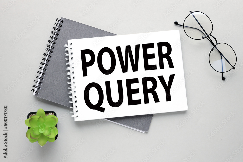 Description of Power Query on the page. on a gray background. two notebooks Description of Power Query on the page. on a gray background. two notebooks