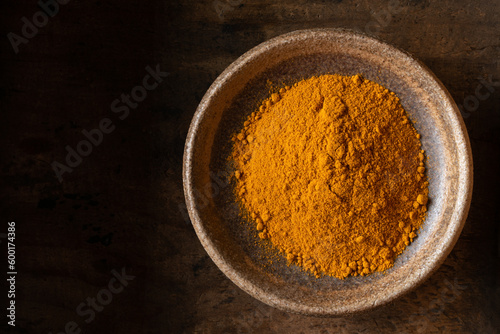 Ground Turmeric in a Bowl