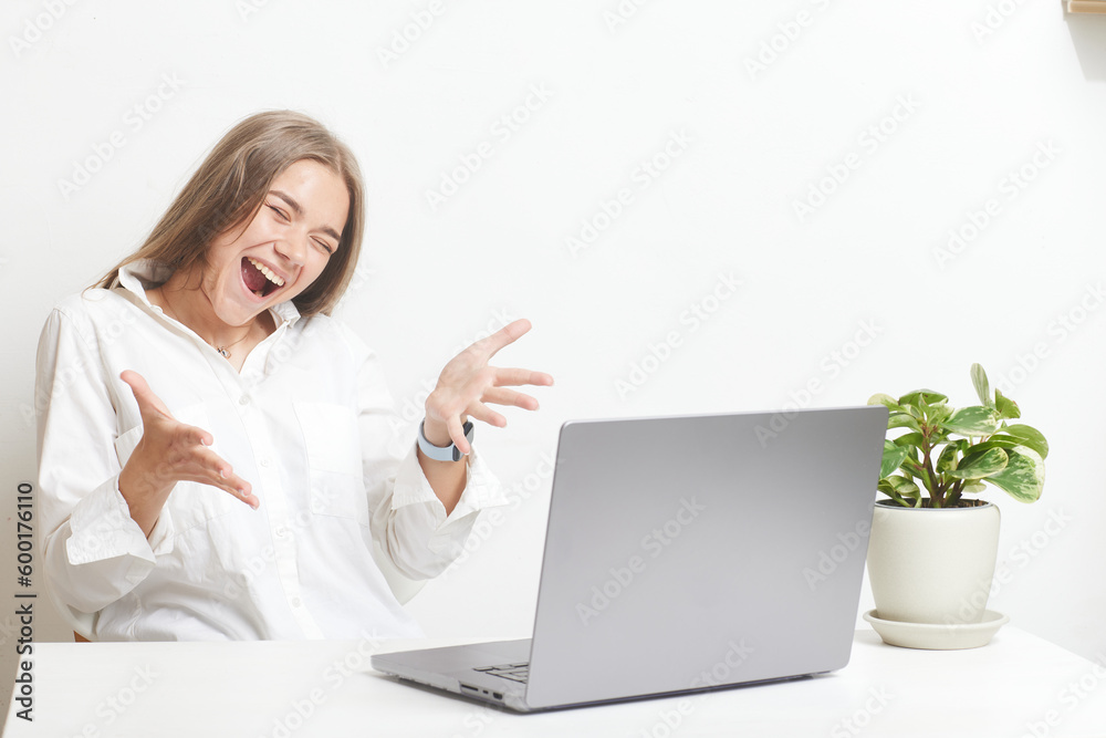 happy girl with laptop rejoices on white background happy girl with laptop rejoices on white background