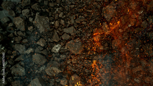 Burning coal with fire, top view shot.