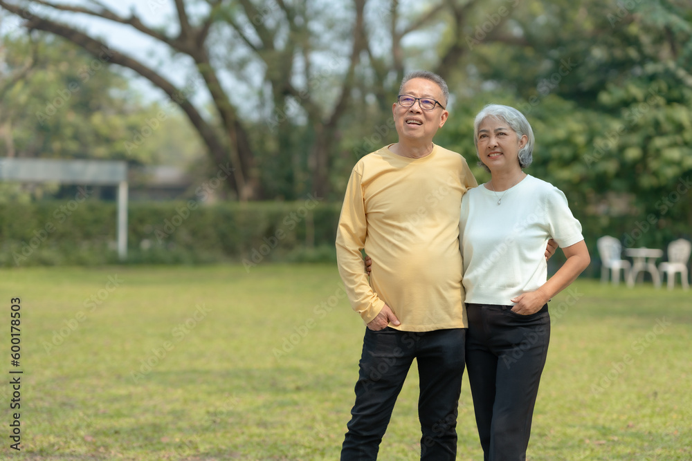 Elderly couple. Asian couple giving love to each other smiling happily. Happy Asian senior couple in the park Elderly couple. Asian couple giving love to each other smiling happily. Happy Asian senior couple in the park