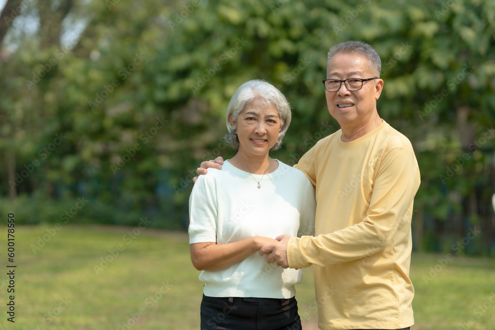 Elderly couple. Asian couple giving love to each other smiling happily. Happy Asian senior couple in the park Elderly couple. Asian couple giving love to each other smiling happily. Happy Asian senior couple in the park
