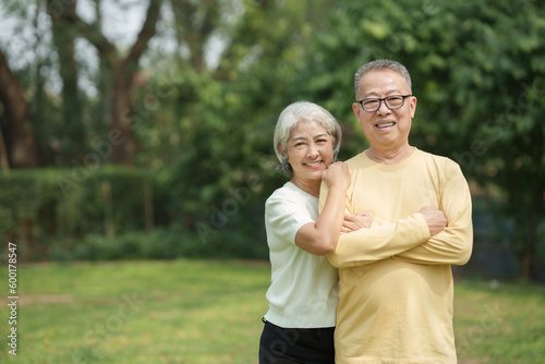 Elderly couple. Asian couple giving love to each other smiling happily. Happy Asian senior couple in the park