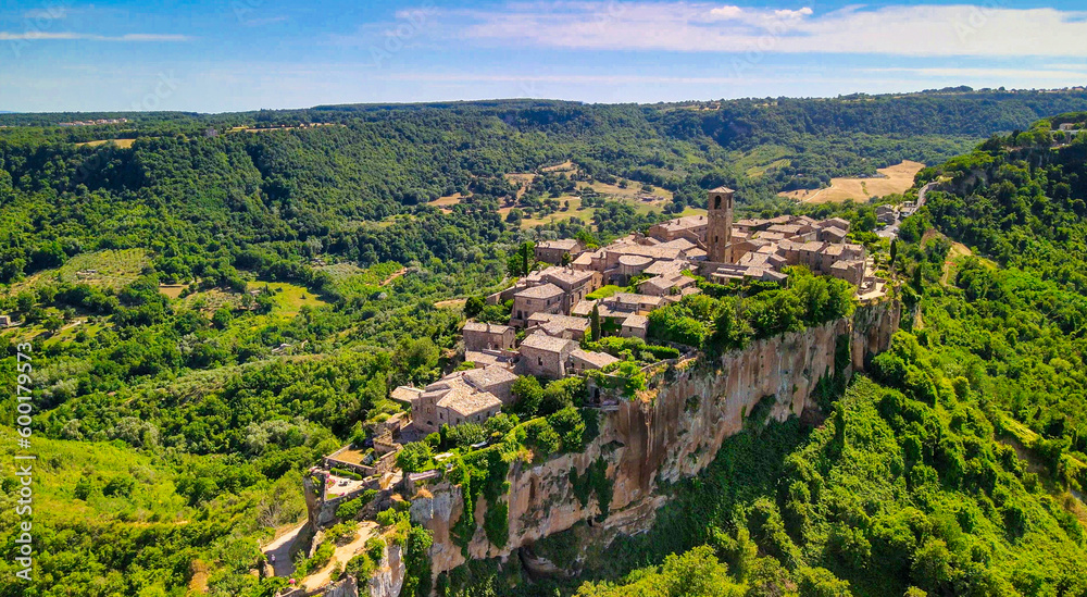 Panoramic aerial view of Civita di Bagnoregio from a flying drone around the medieval city, Italy.