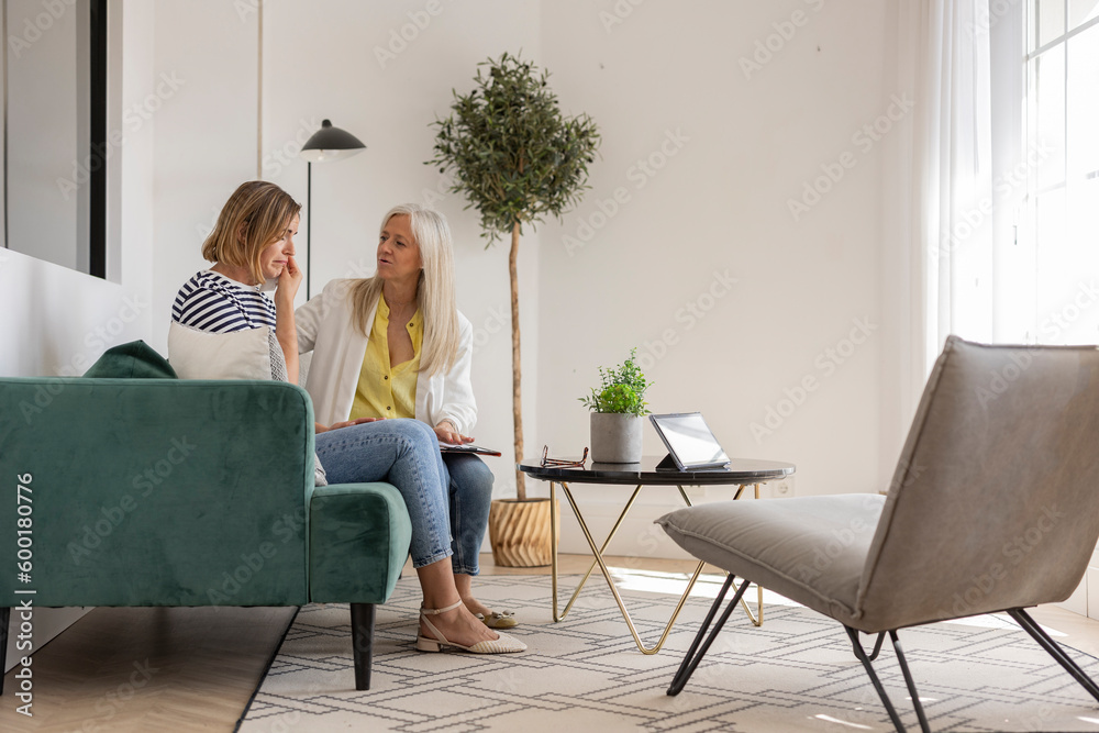 Mature woman is at the therapy psychologist, session, sad woman crying for her depression and her mental problems in the psychological medical consultation Mature woman is at the therapy psychologist, session, sad woman crying for her depression and her mental problems in the psychological medical consultation