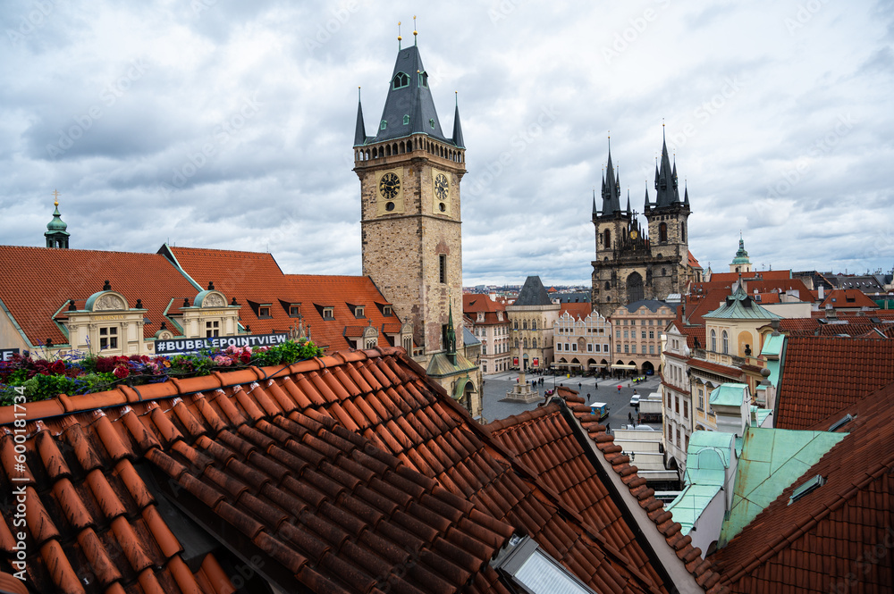 Panorama of Prague city with medieval , old architecture, Cathedrals, gothic towers and spires. landscape of Praga, view on the town with red roofs on houses and top landmarks.
