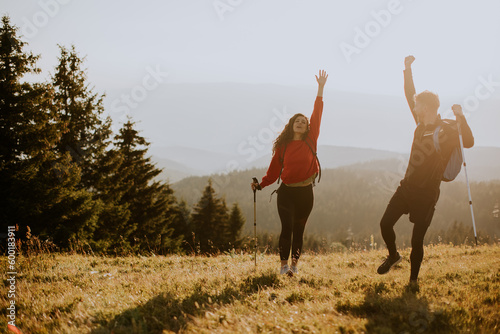Smiling couple walking with...