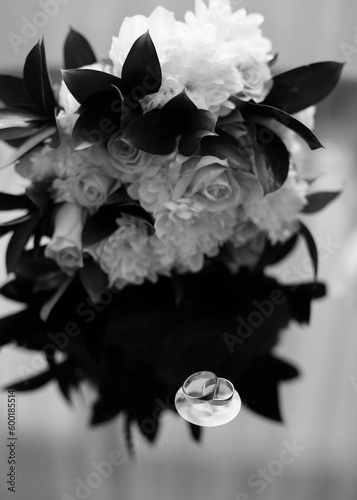 Wedding rings on the background of a bouquet. Wedding in details. Preparation for the ceremony. Wedding rings