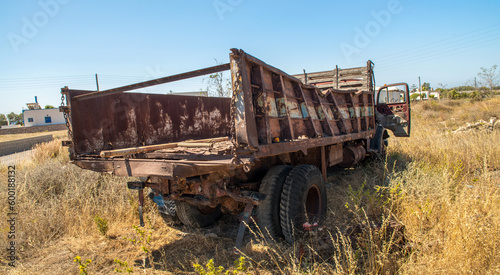 Old rusty truck abandoned on the grass