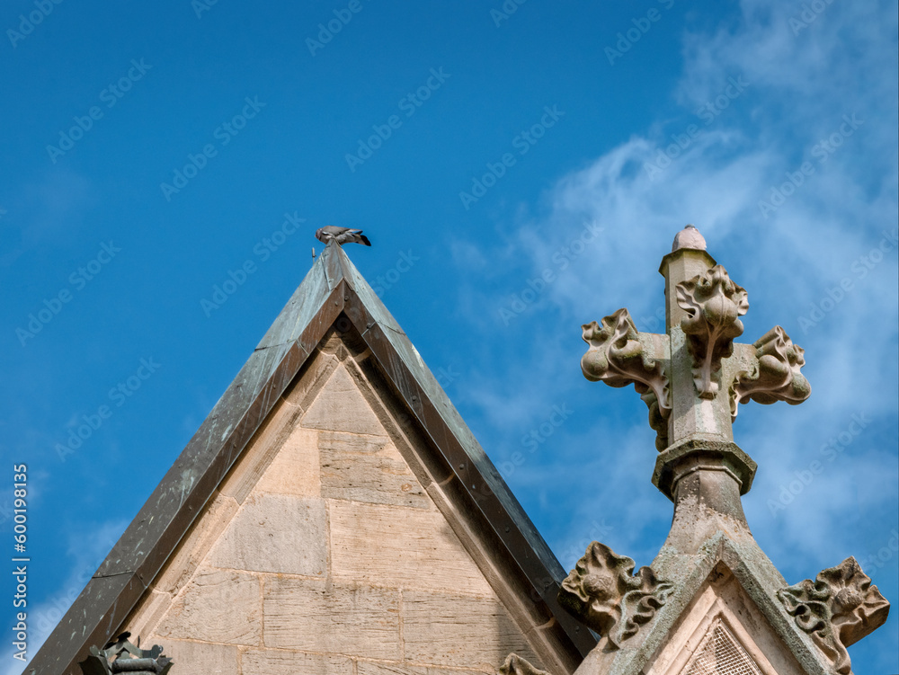 Detail of the pediment with ornaments of the Basilica of St. Cyriakus in Duderstadt Detail of the pediment with ornaments of the Basilica of St. Cyriakus in Duderstadt